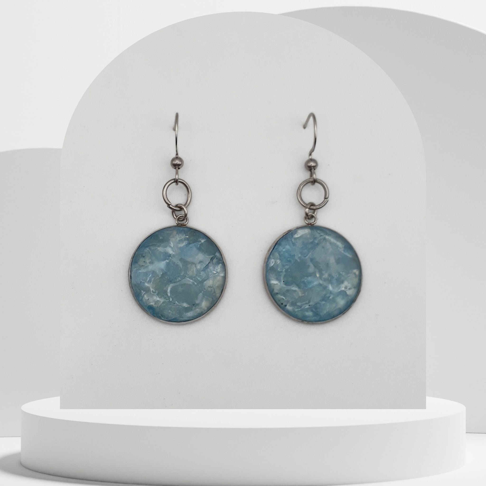 Stainless steel drop earrings with crushed aquamarine gemstones in 20mm resin bezel