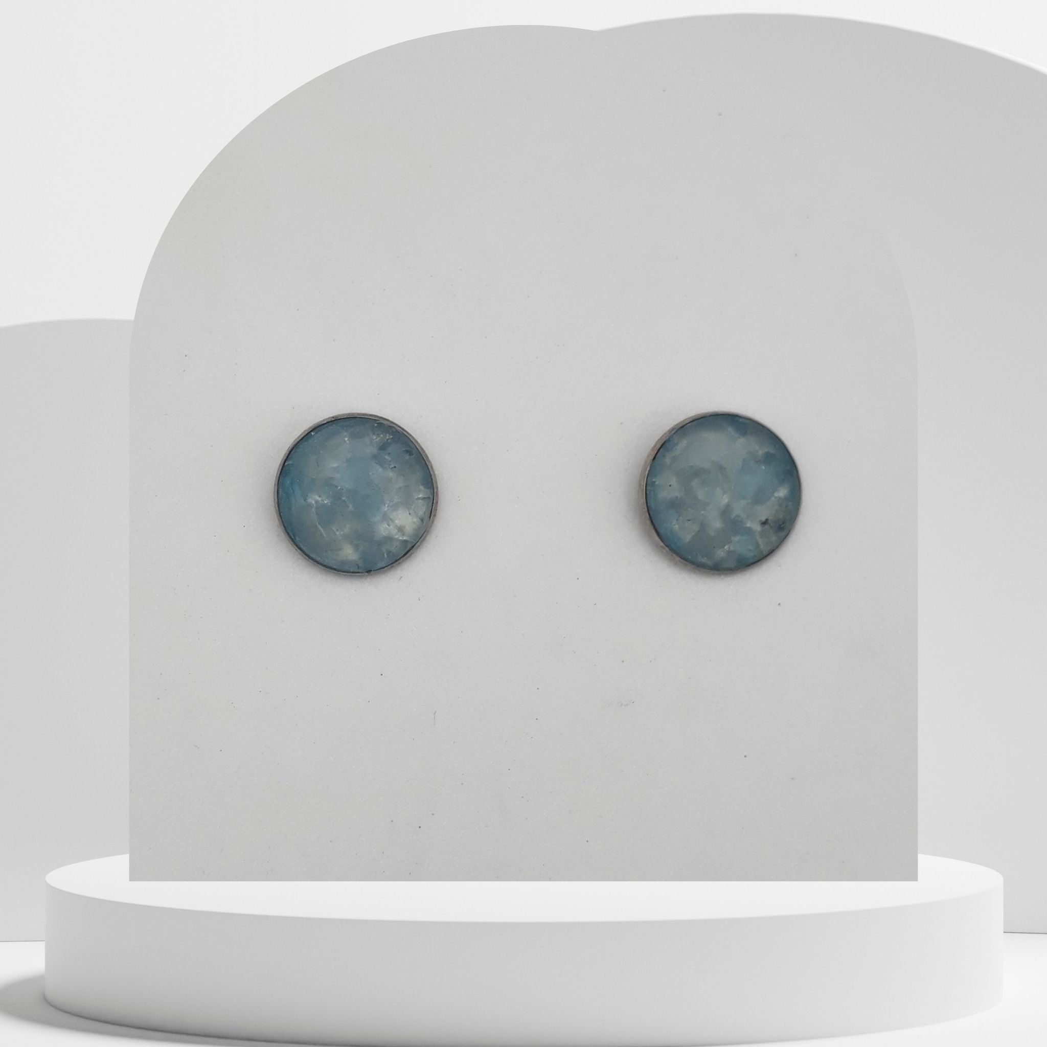 Stainless steel stud earrings with crushed aquamarine gemstones in 12mm resin bezel