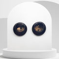 Handmade black polymer clay stud earrings with gold leaf and resin finish