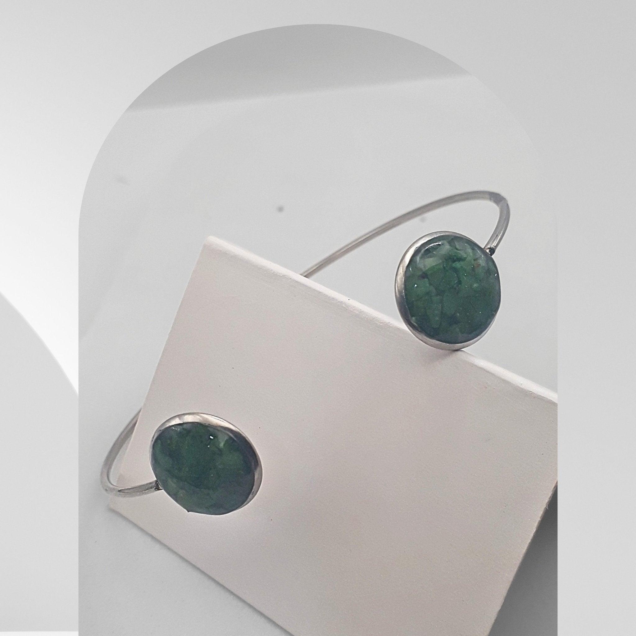 Handmade stainless steel open cuff bangle with crushed green bloodstone sealed in resin