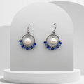 White pearl drop earrings with blue beaded stainless steel circle and hook
