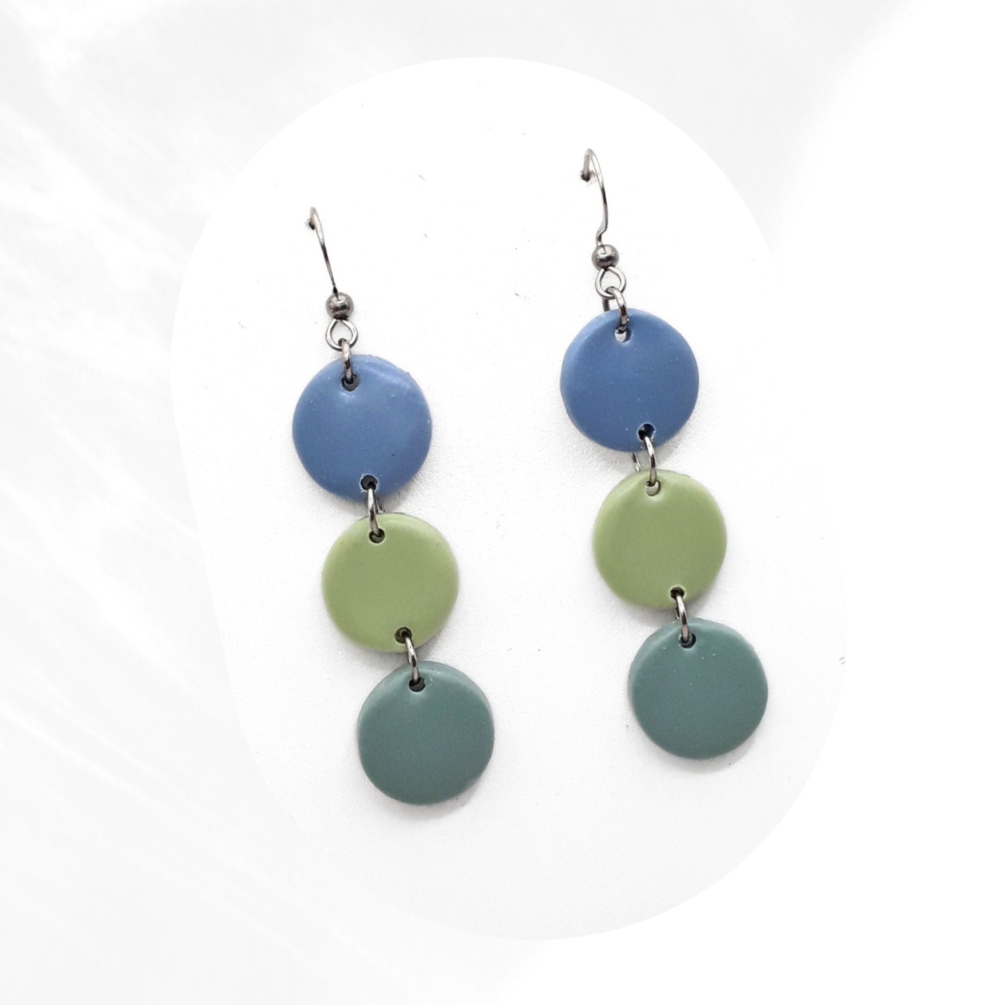 Handmade polymer clay dangle earrings in blue and green tones with stainless steel hooks, lightweight statement earrings