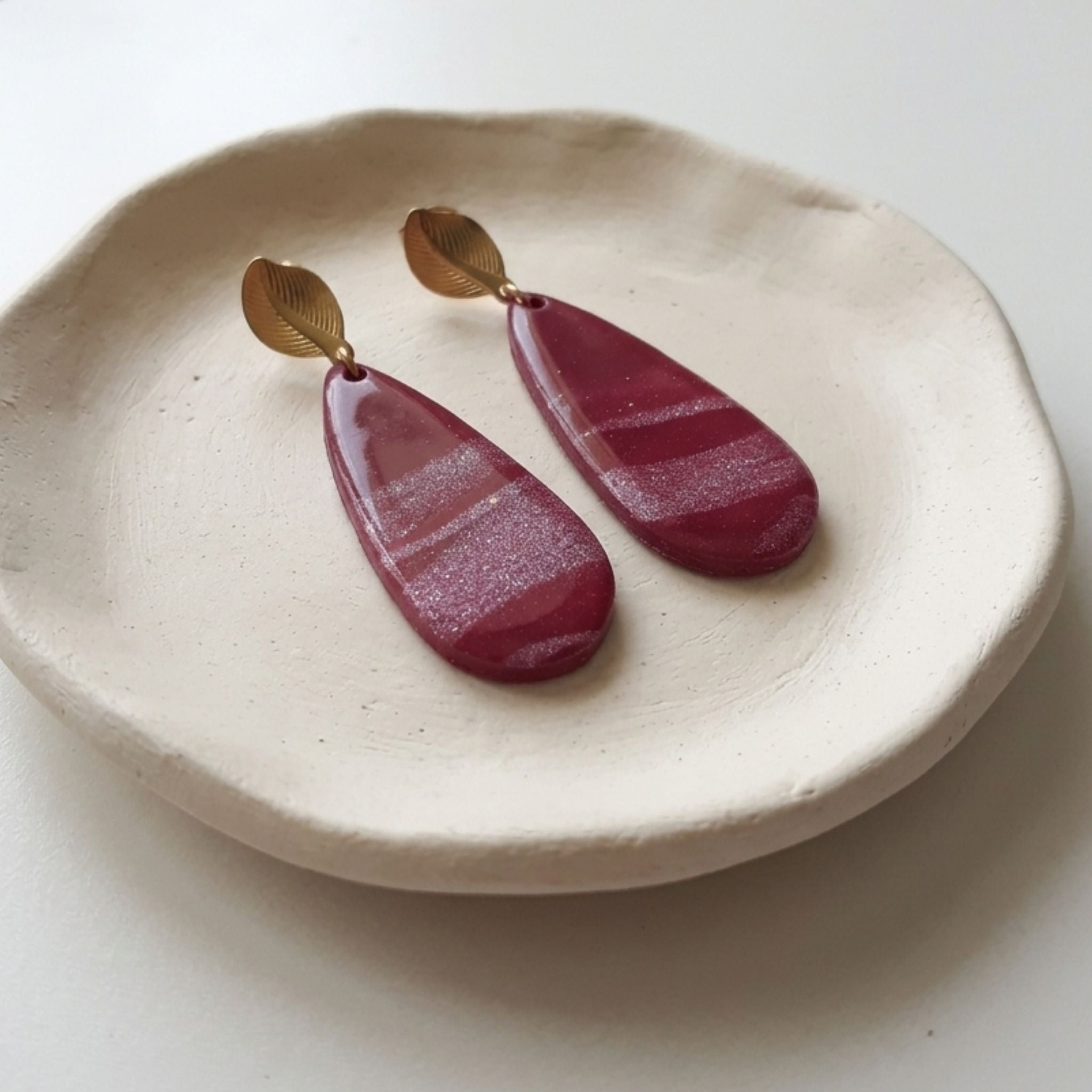 Burgundy shimmer polymer clay teardrop earrings with gold-plated stainless steel leaf ear studs