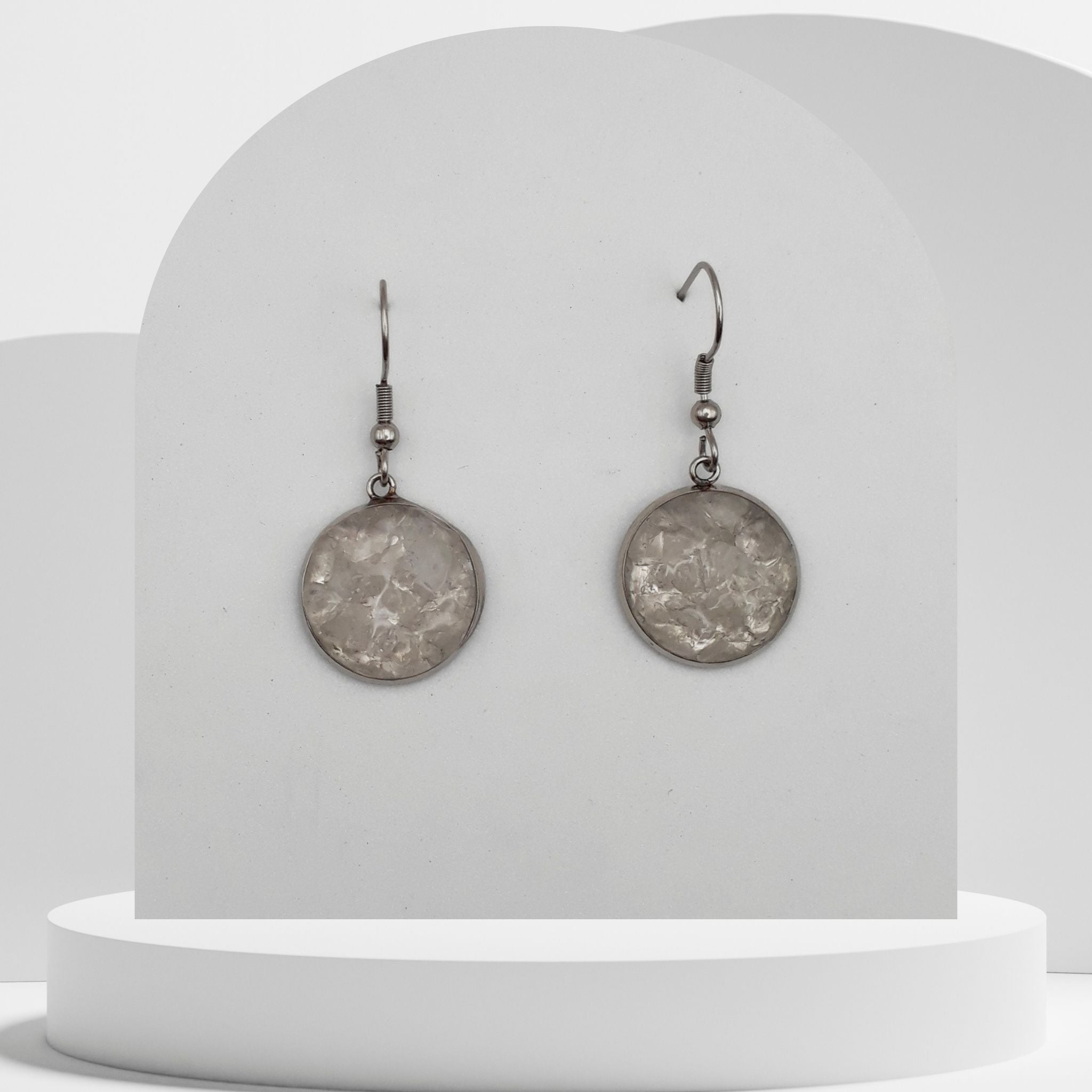 Stainless steel drop earrings with crushed clear quartz gemstones in 16mm resin bezel