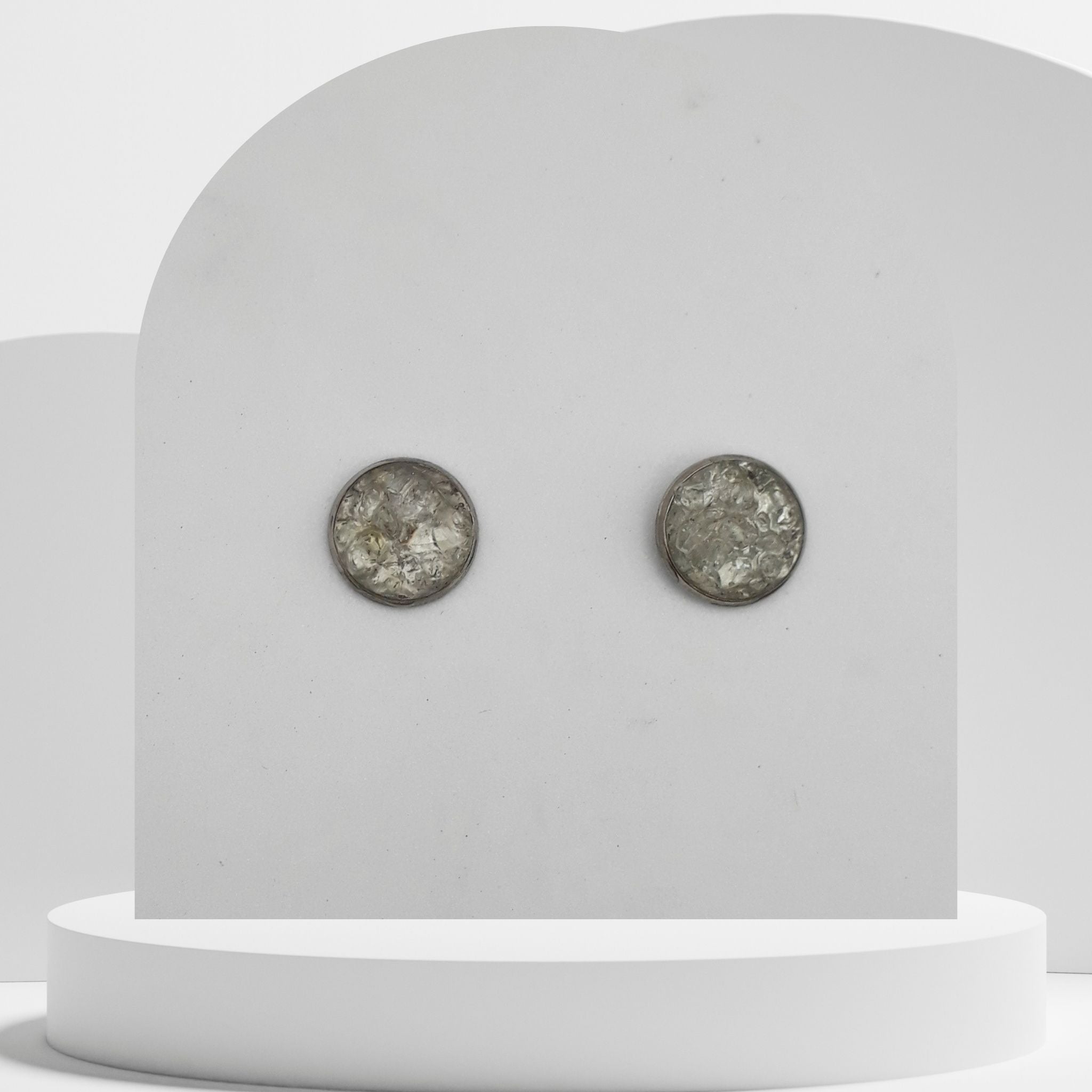 Stainless steel stud earrings with 12mm bezel set crushed clear quartz gemstones sealed in glass-like resin