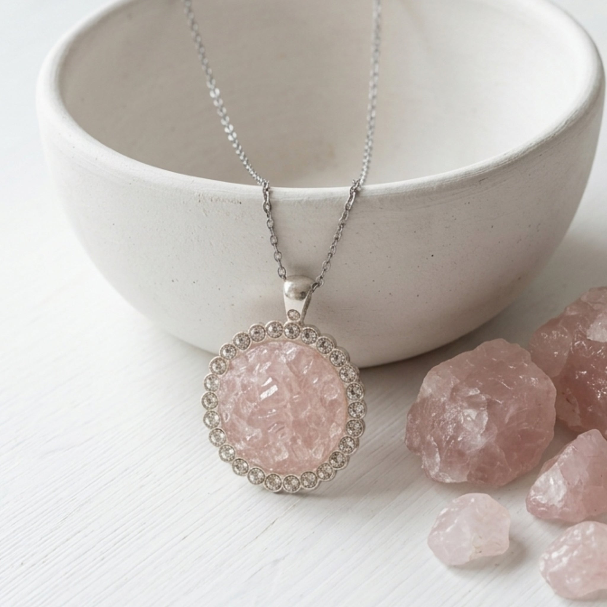Handmade rose quartz round pendant necklace with crushed gemstones, rhinestone border and stainless steel cable chain.