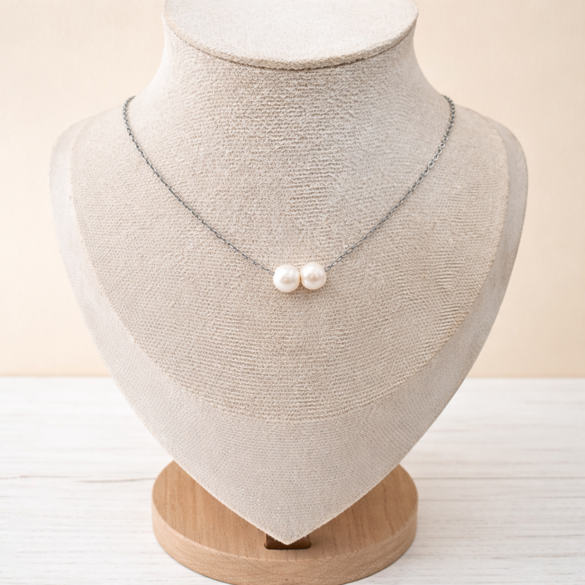 Double 7 mm freshwater pearl floating necklace on stainless steel chain with lobster clasp.