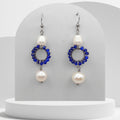 Double white pearl dangle earrings with dark blue beaded circle and stainless steel hooks