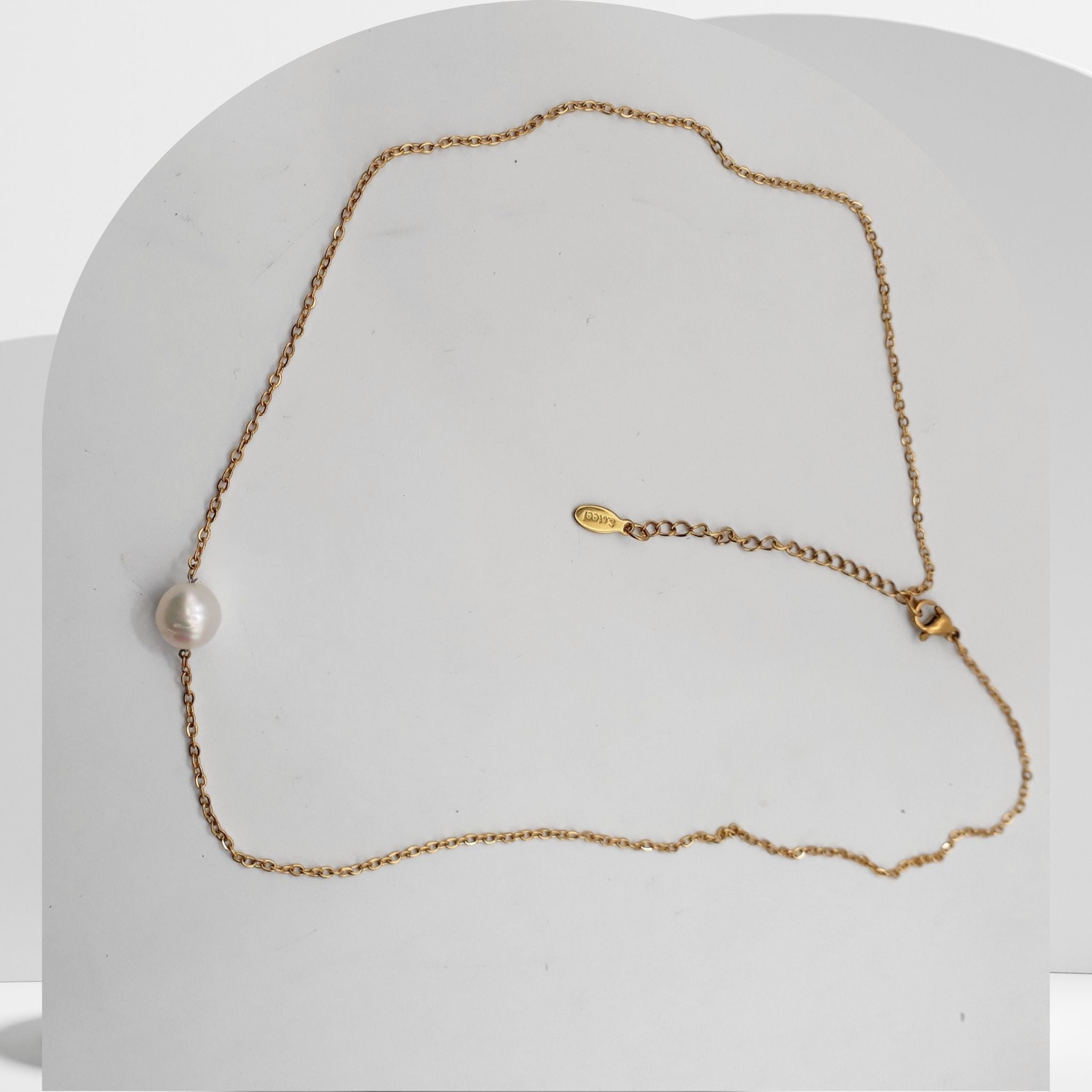 Gold plated stainless steel necklace with floating white freshwater pearls on cable chain