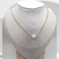 Gold plated stainless steel necklace with floating white freshwater pearls on cable chain
