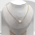 Gold plated stainless steel necklace with floating white freshwater pearls on cable chain