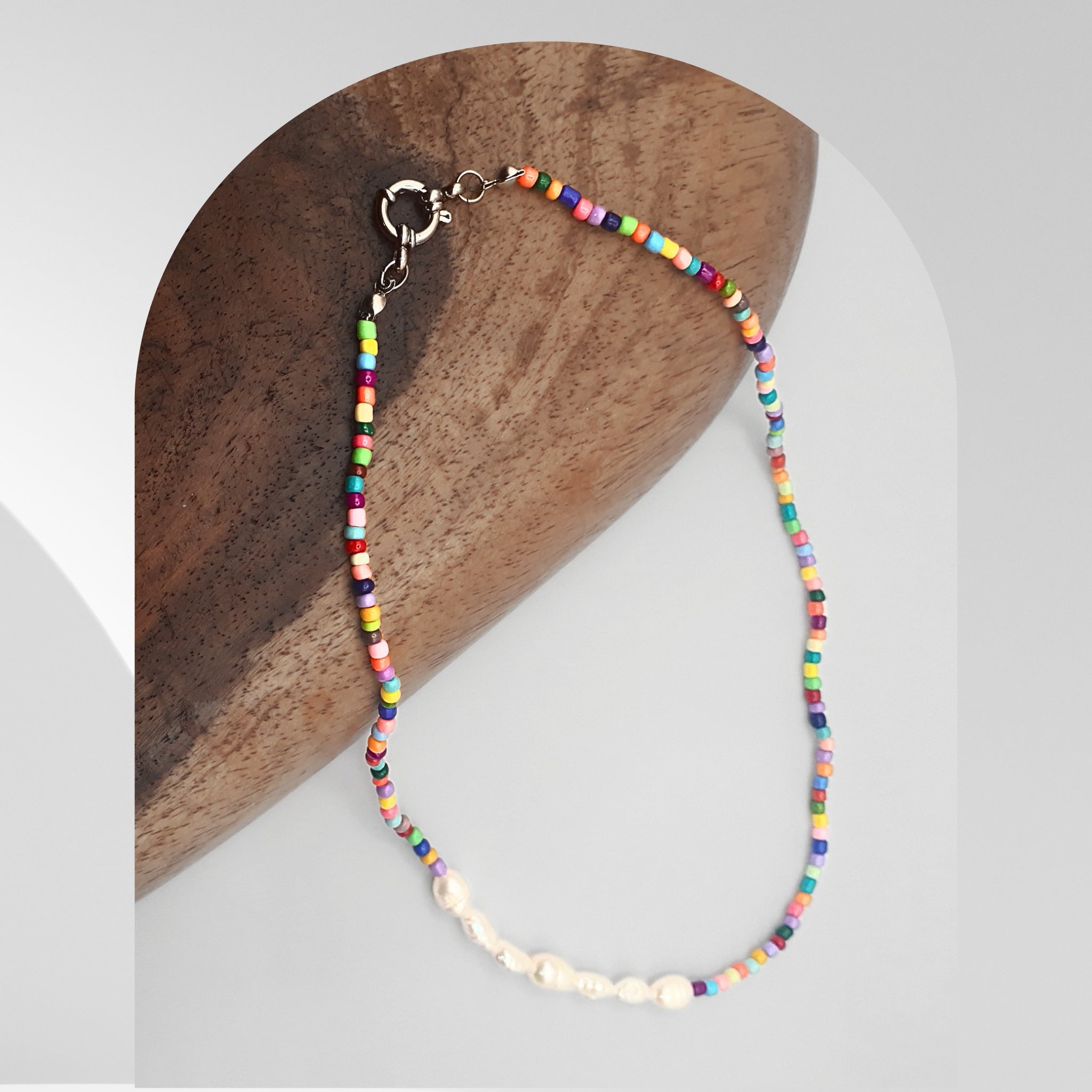 Handmade 40cm necklace featuring freshwater pearls and multicolour glass beads with a stainless steel spring ring clasp.