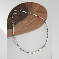 Handmade colourful beaded necklace featuring freshwater pearls and multicoloured seed beads with a spring ring clasp.