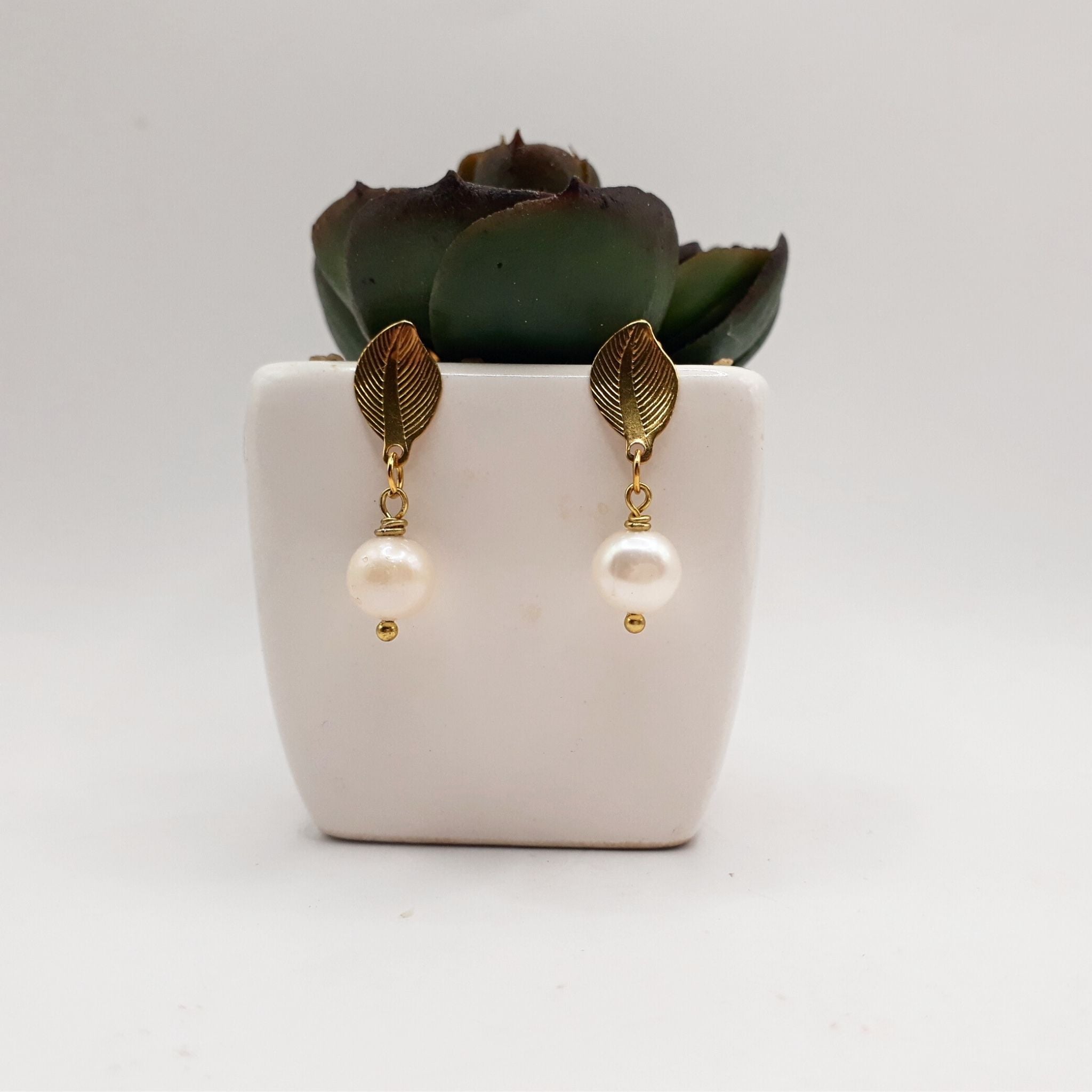 Handmade freshwater pearl earrings feature a beautifully refined and nature-inspired design.