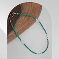Handmade necklace featuring freshwater rice pearls and turquoise glass beads with a stainless steel spring ring clasp.