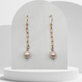 Handmade white freshwater pearl dangle earrings with gold paperclip chain and hooks