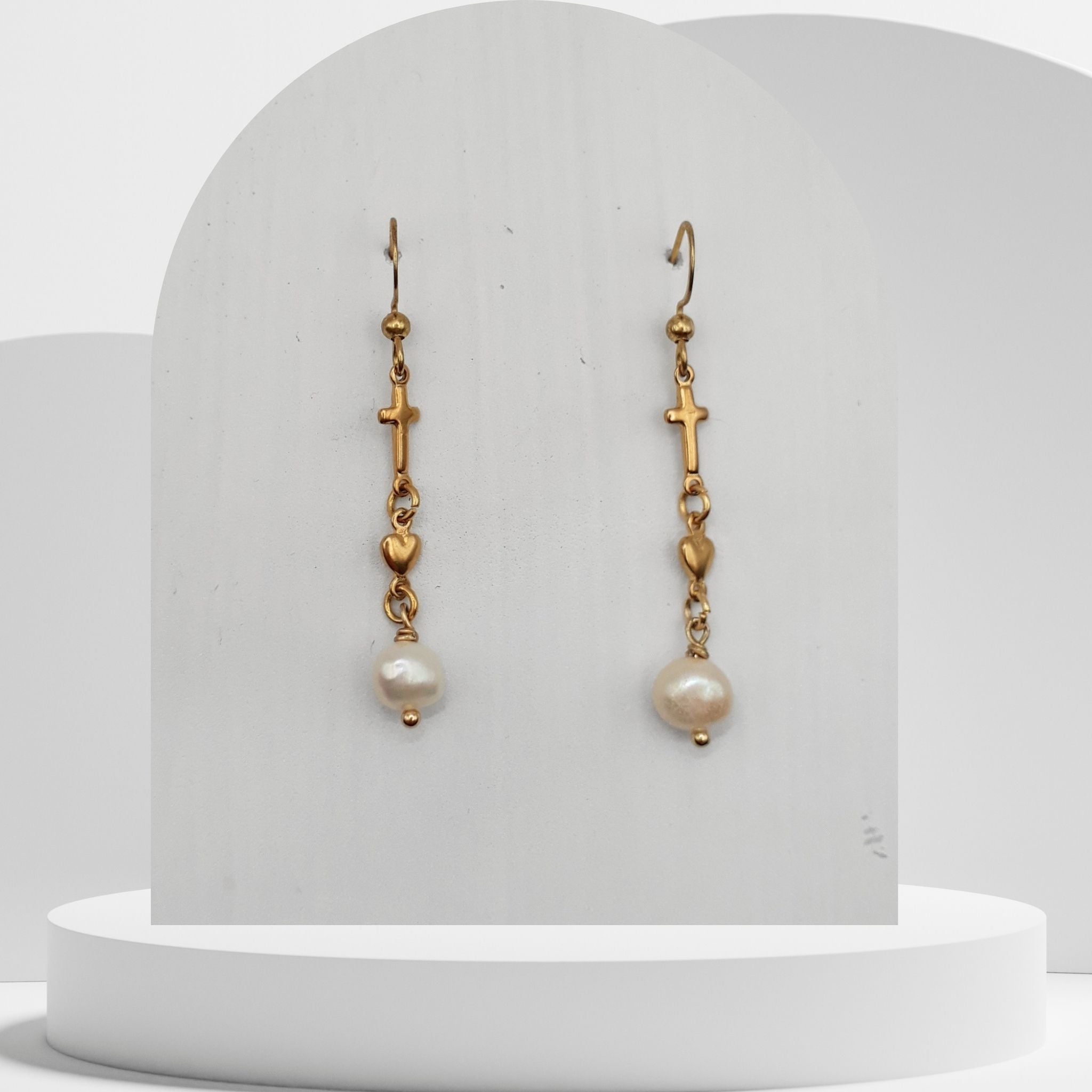 Handmade white freshwater pearl dangle earrings with gold cross and heart charms