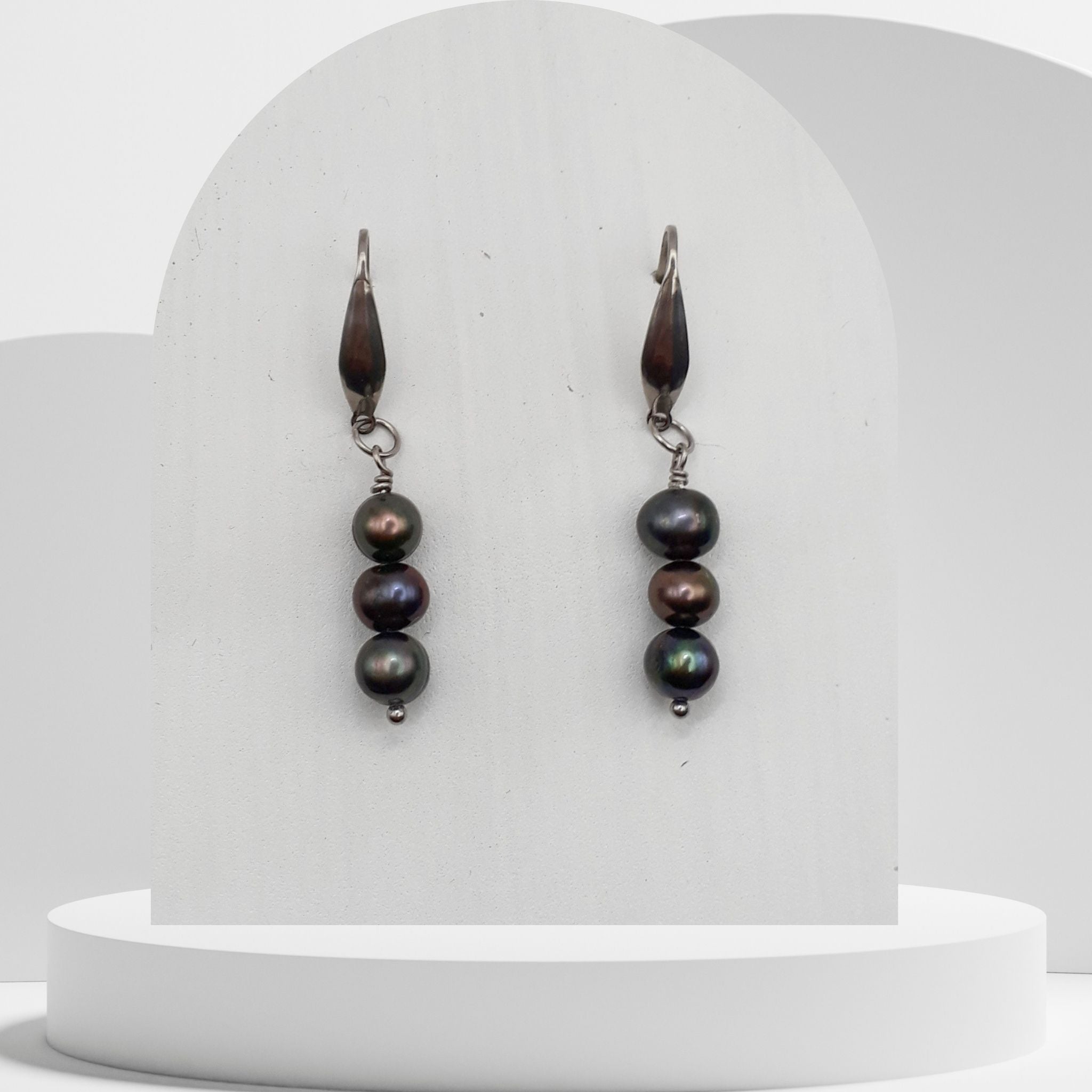 Handmade drop earrings with three green and brown freshwater pearls on stainless steel hooks