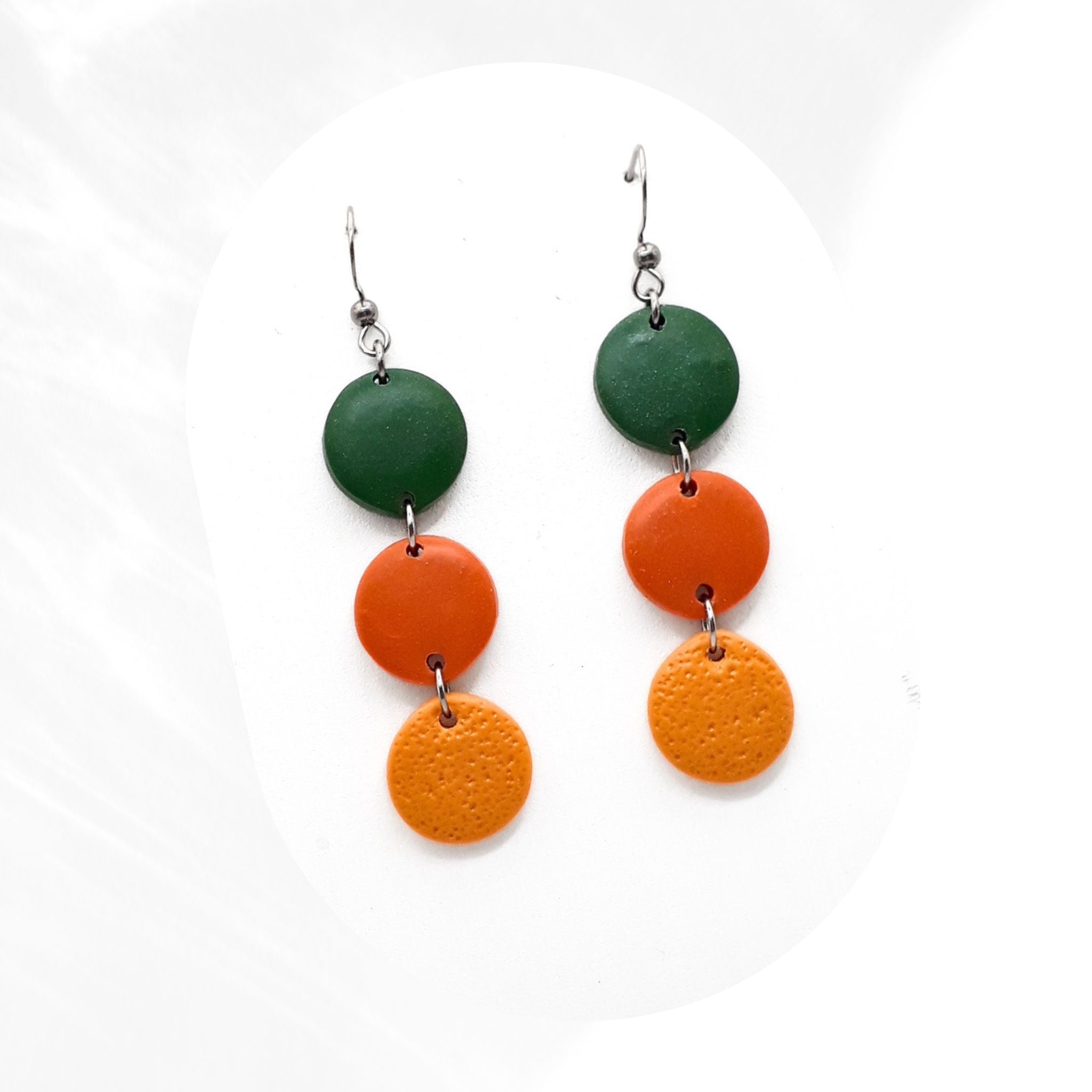 Handmade polymer clay drop earrings in green and mustard tones with stainless steel hooks, lightweight statement earrings