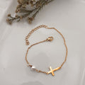 Handmade 18K gold plated stainless steel bracelet with pearl cross and cable chain - Kiooinsitu