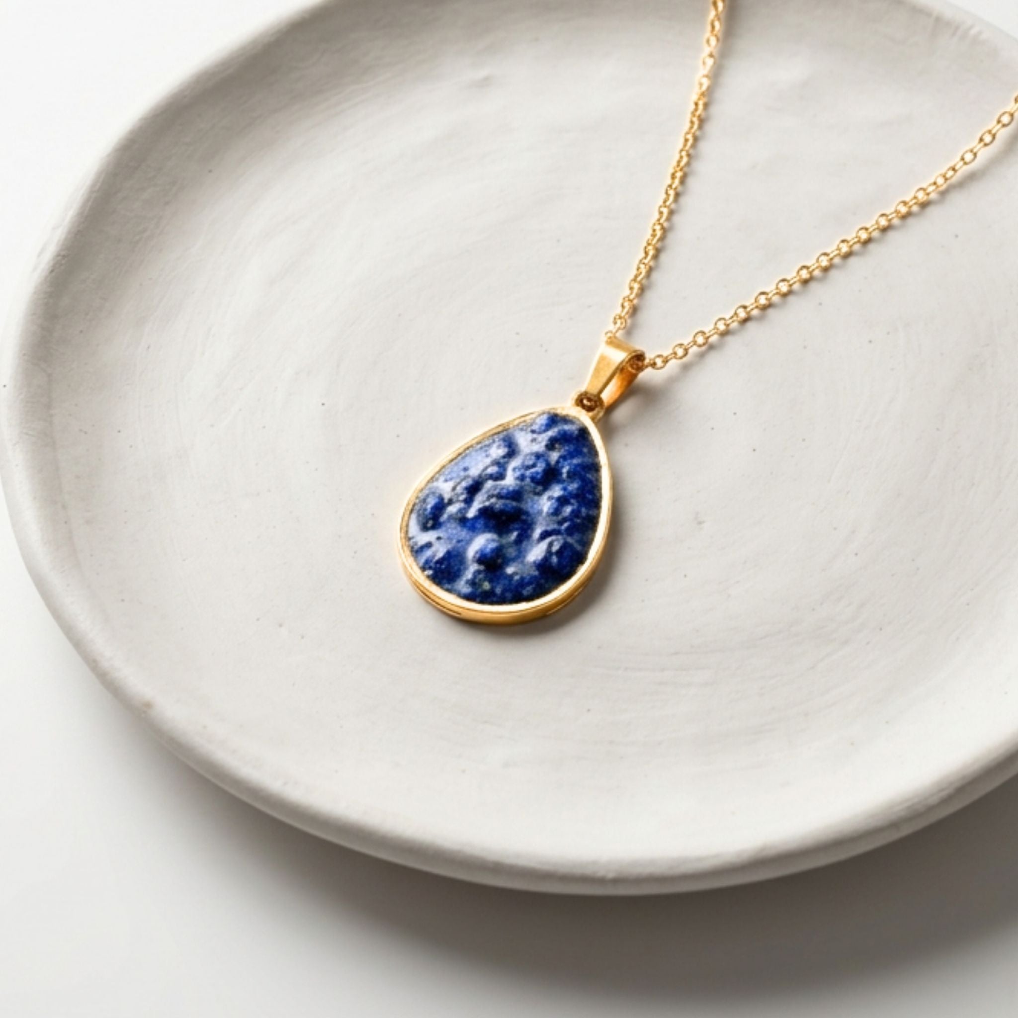 Handmade gold plated stainless steel necklace with crushed blue granite teardrop pendant