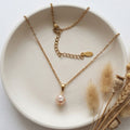 Handmade gold-plated stainless steel necklace with soft pink 7mm pear-shaped freshwater pearl