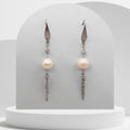 Handmade white freshwater pearl tassel earrings with stainless steel chains and elegant hook