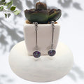 Handmade stainless steel dangle earrings with crushed imperial jasper resin bezel