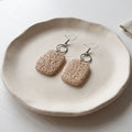 Natural beige textured polymer clay dangle earrings with stainless steel shepherd hooks