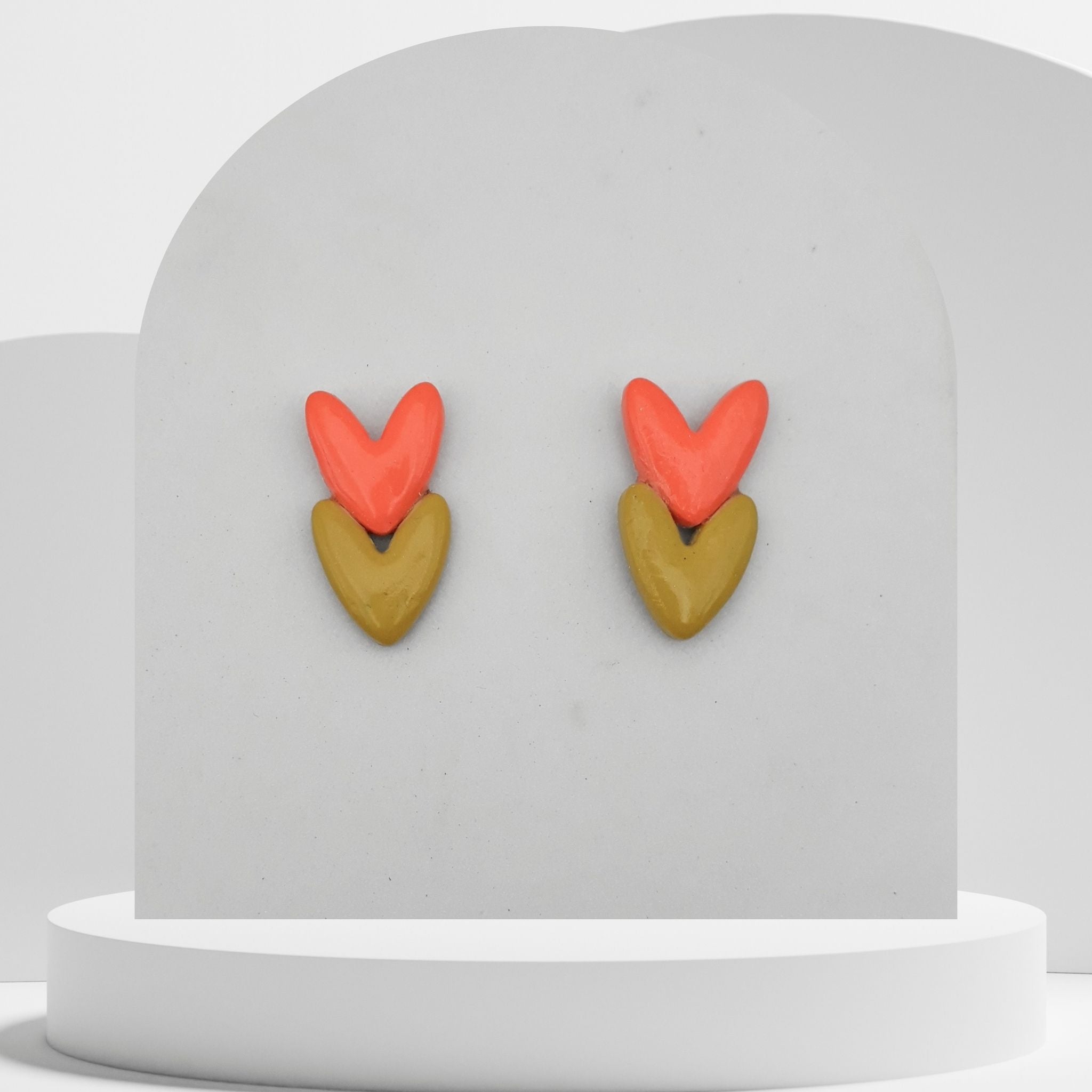Orange and olive green double heart polymer clay stud earrings with stainless steel pins