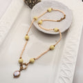 Handmade peach pink coin pearl necklace with beige glass and yellow ceramic beads