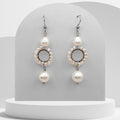 Handmade stainless steel dangle earrings with circular pearl beaded design and two natural white freshwater pearls