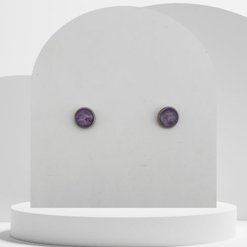 Small stainless steel stud earrings with crushed amethyst gemstones in 7mm resin bezel