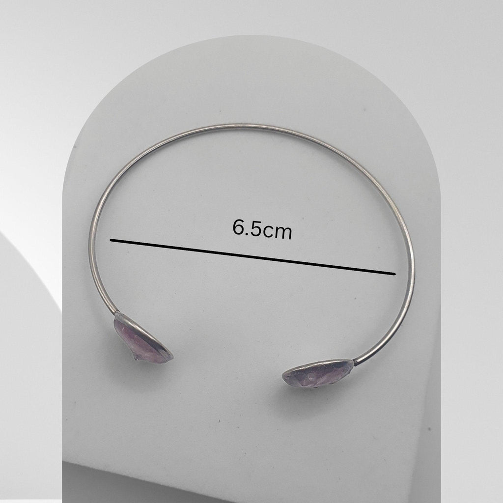 Handmade stainless steel open cuff bangle with crushed Pink Aura Quartz sealed in resin