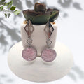 Handmade stainless steel drop earrings with crushed pink aura quartz resin bezel