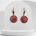 20mm stainless steel drop earrings with crushed natural red coral sealed in glossy resin and finished with elegant ear hooks