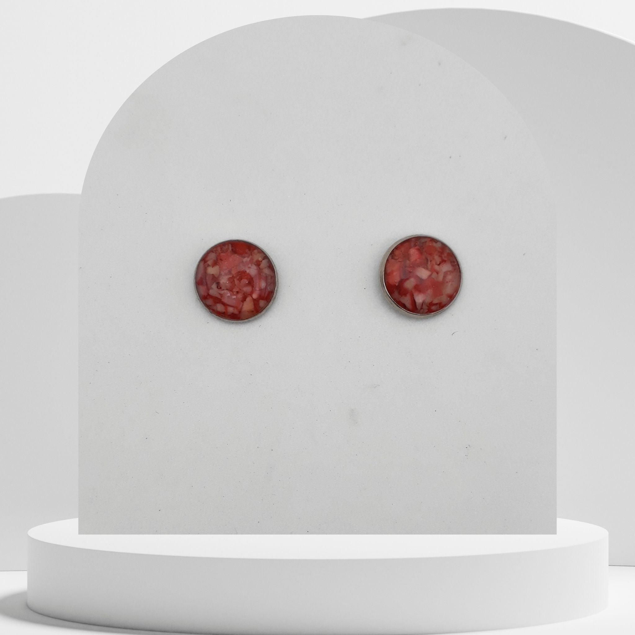 12mm stainless steel stud earrings with crushed natural red coral sealed in glossy resin bezel setting