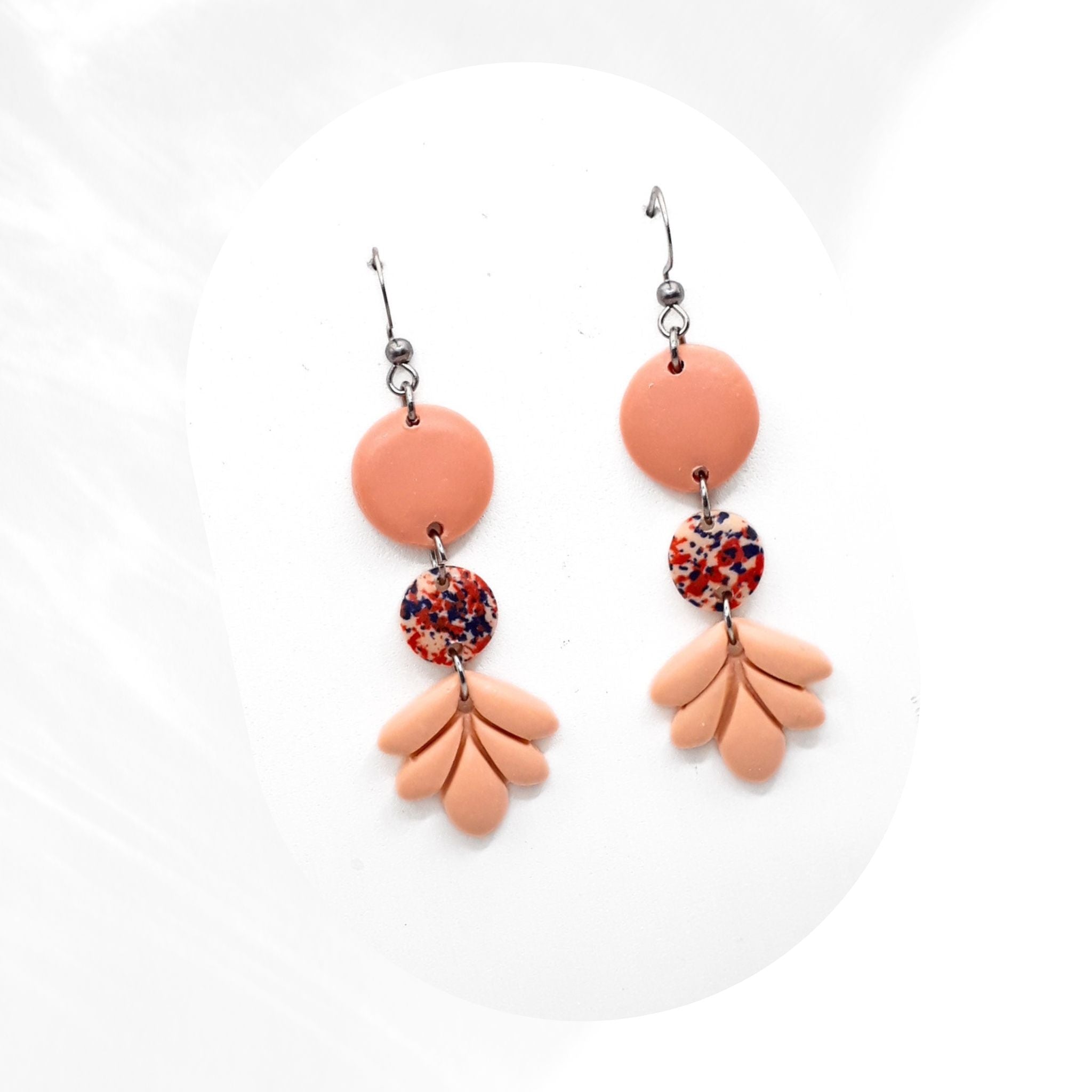 Soft salmon pink polymer clay handmade dangle earrings with speckled accent and petal design, lightweight earrings with stainless steel hooks