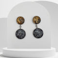 Stainless steel drop earrings with 18mm snowflake obsidian bezel and 14mm gold leaf bezel stud, sealed in resin