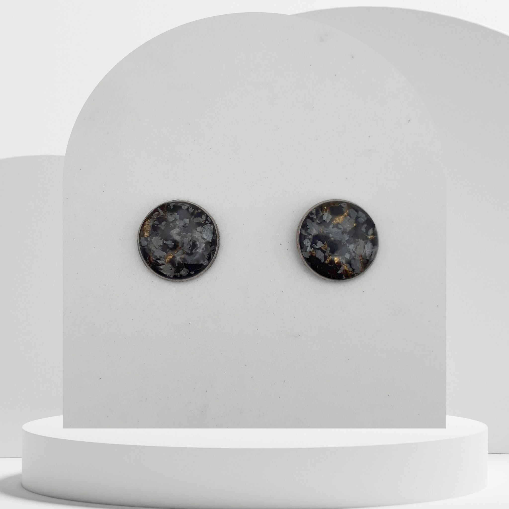 Stainless steel stud earrings with 14mm bezel set crushed snowflake obsidian and gold leaf sealed in glass-like resin