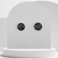 Stainless steel stud earrings with 12mm bezel set crushed snowflake obsidian gemstones sealed in glass-like resin