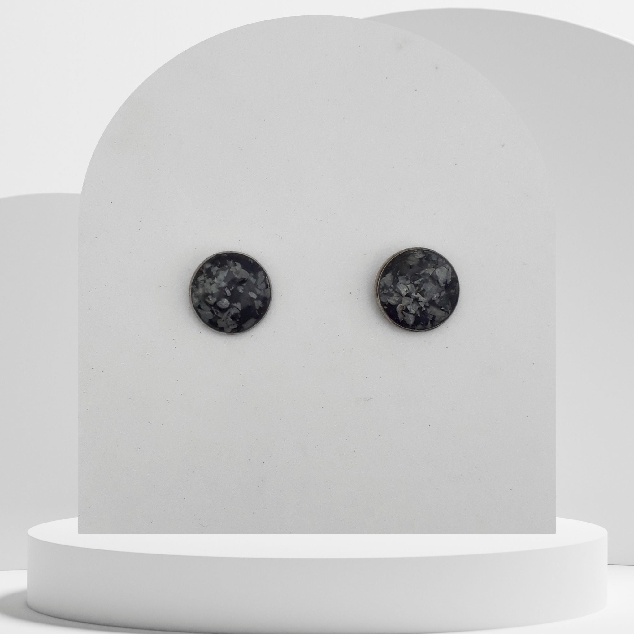 Stainless steel stud earrings with 12mm bezel set crushed snowflake obsidian gemstones sealed in glass-like resin
