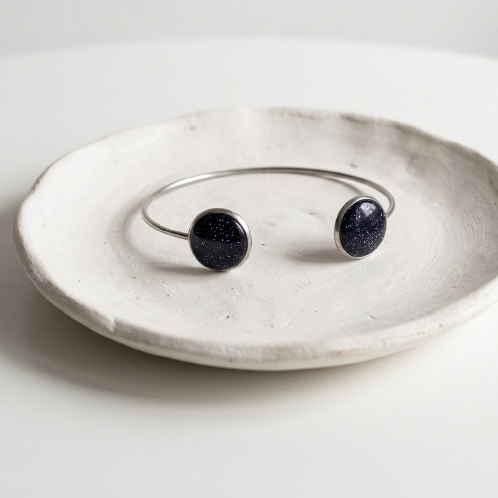 Handmade 304 stainless steel cuff bangle with natural crushed Star Stone 12mm bezel settings and clear resin finish.