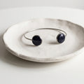 Handmade 304 stainless steel cuff bangle with natural crushed Star Stone 12mm bezel settings and clear resin finish.