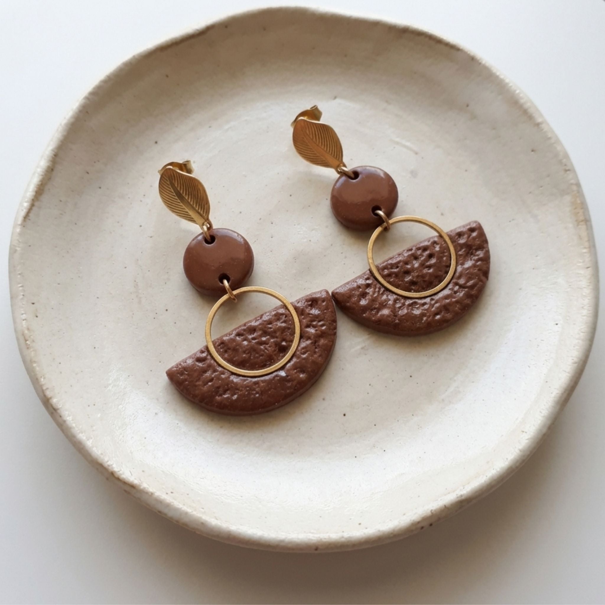 Handmade brown polymer clay statement earrings with textured half-moon pendants and gold-tone details