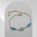 Handmade gold plated stainless steel bracelet with turquoise bezel and turquoise beads