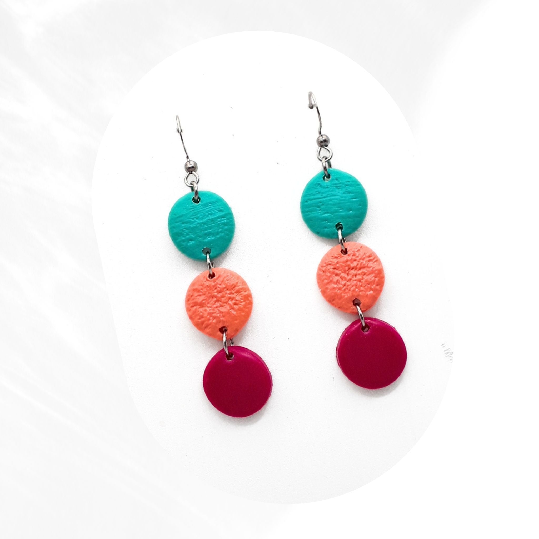 Handmade polymer clay dangle earrings in turquoise, coral pink and purple tones with stainless steel hooks, lightweight statement earrings