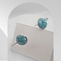 Handmade stainless steel open cuff bangle with natural turquoise sealed in resin