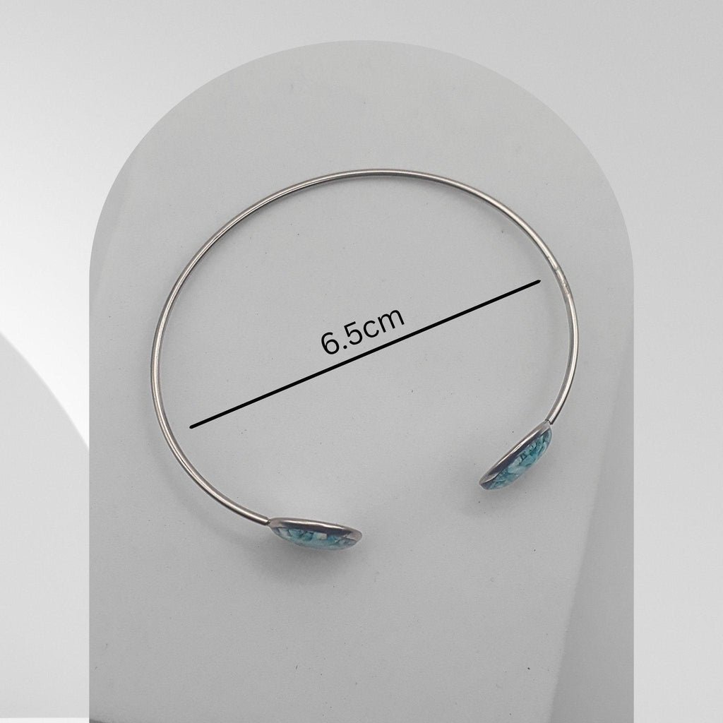 Handmade stainless steel open cuff bangle with natural turquoise sealed in resin