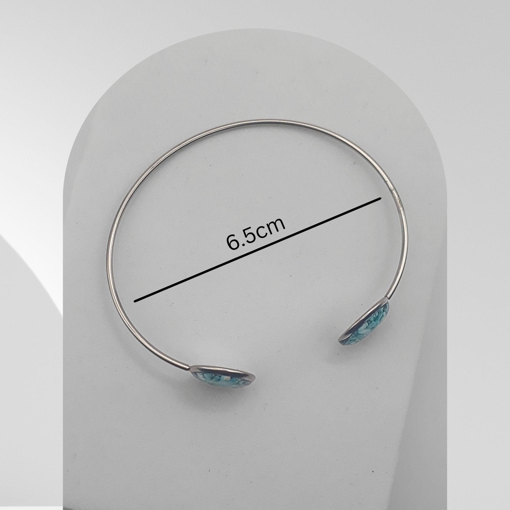 Handmade stainless steel open cuff bangle with natural turquoise sealed in resin